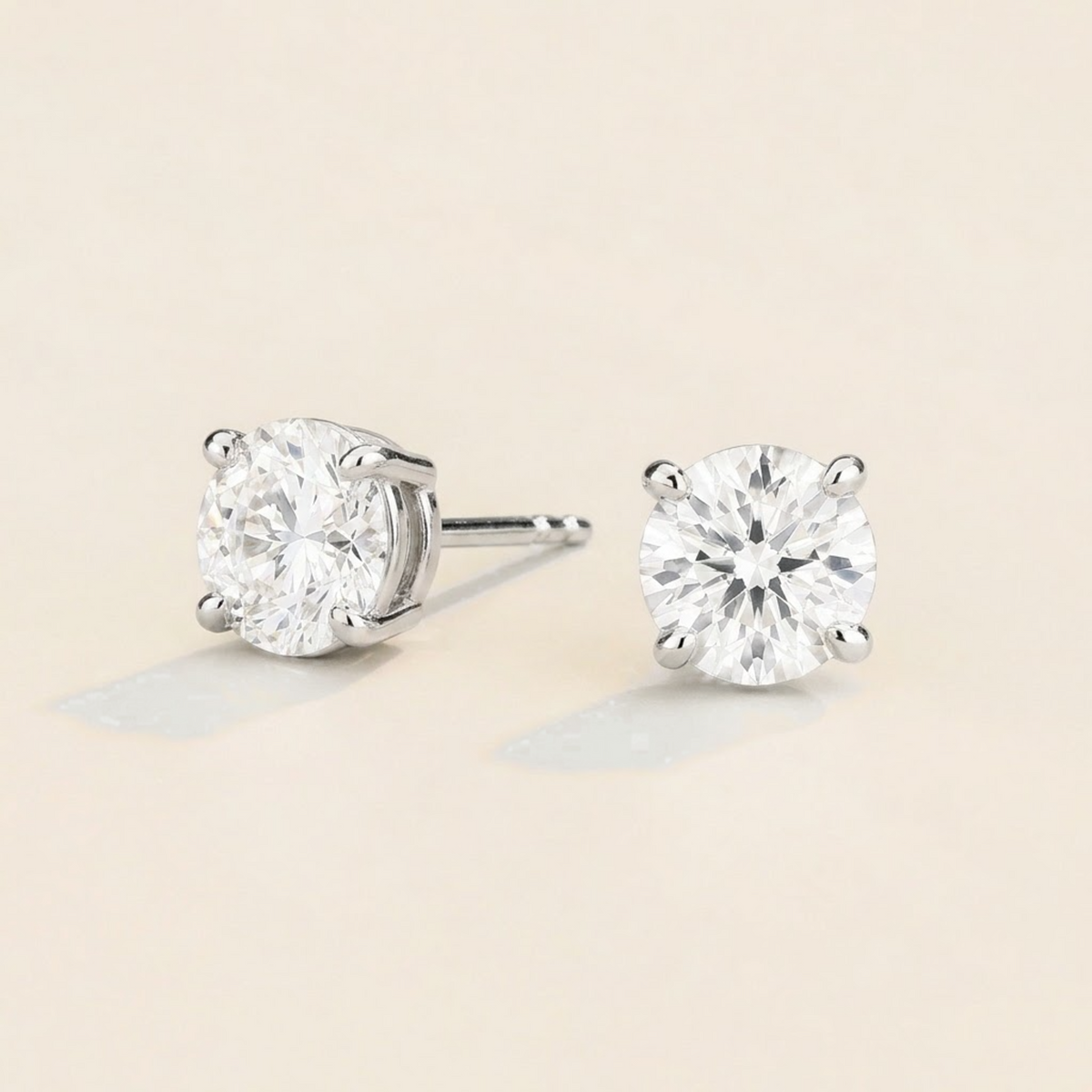 Nina round lab-grown diamond solitaire stud earrings in white gold – angled view | Juvetti