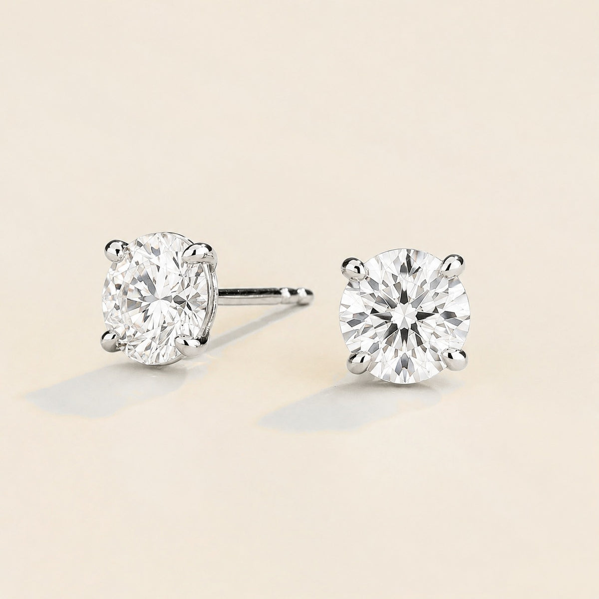 Nina round lab-grown diamond solitaire stud earrings in white gold – angled view | Juvetti