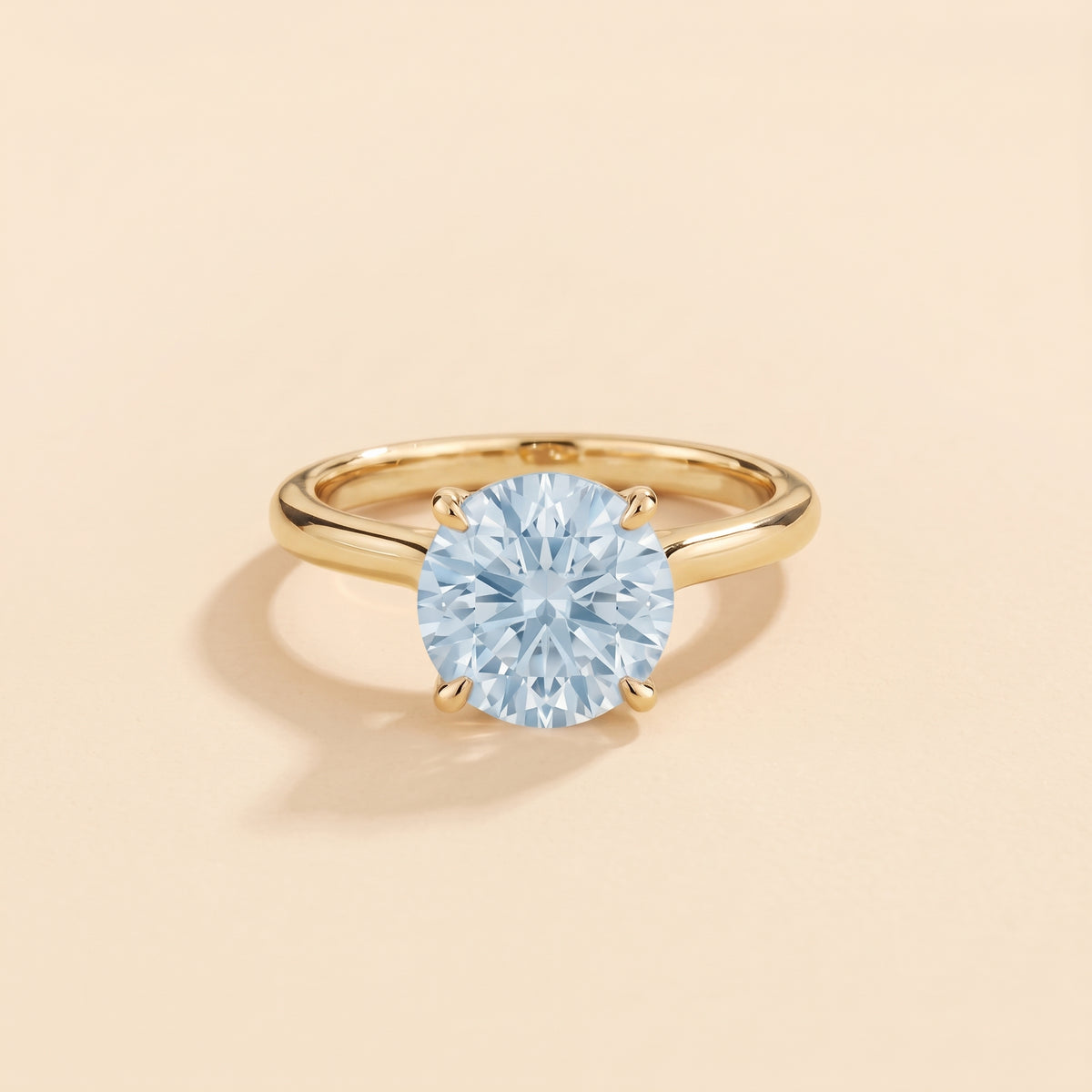 Nina Round Shape Aquamarine Cathedral Solitaire Ring in Gold, front view