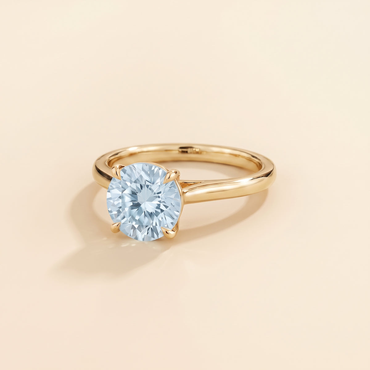 Nina Round Shape Aquamarine Cathedral Solitaire Ring in Gold, three-quarter view