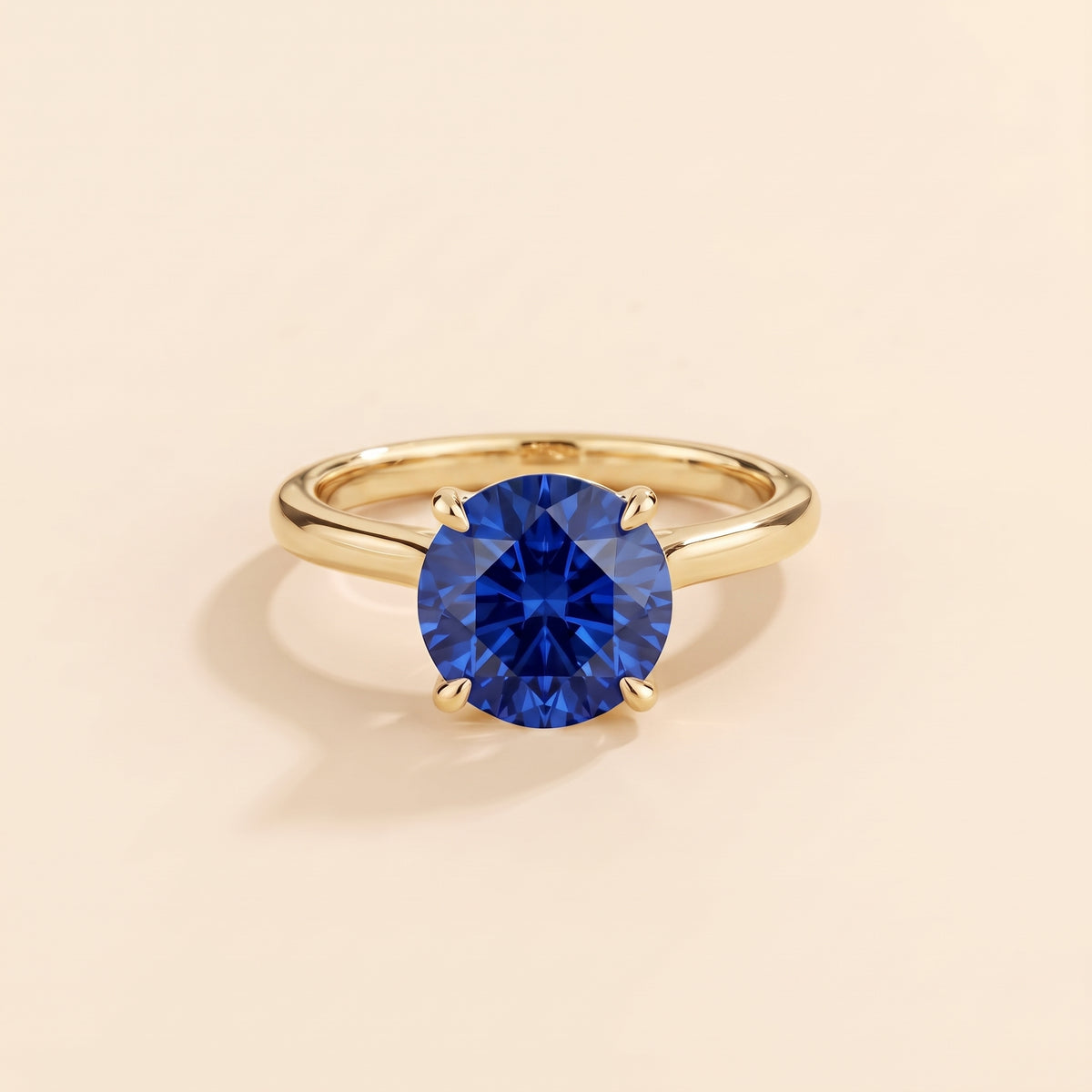 Nina Round Shape Blue Sapphire Cathedral Solitaire Ring in Gold, front view