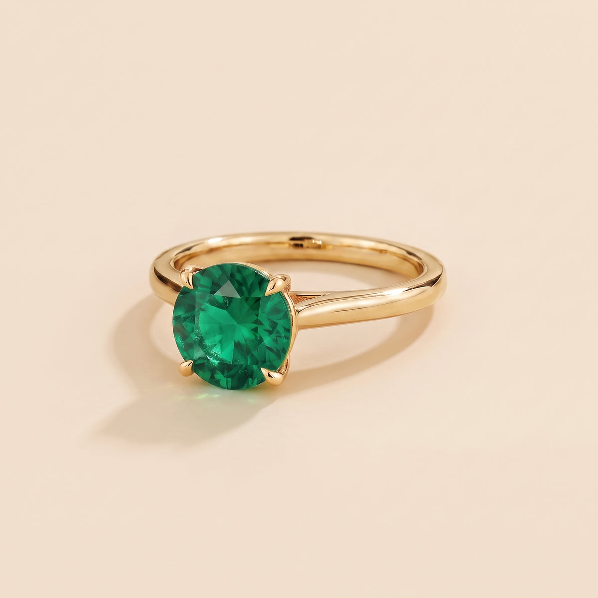 Nina Round Shape Emerald Cathedral Solitaire Ring in Gold, three-quarter view