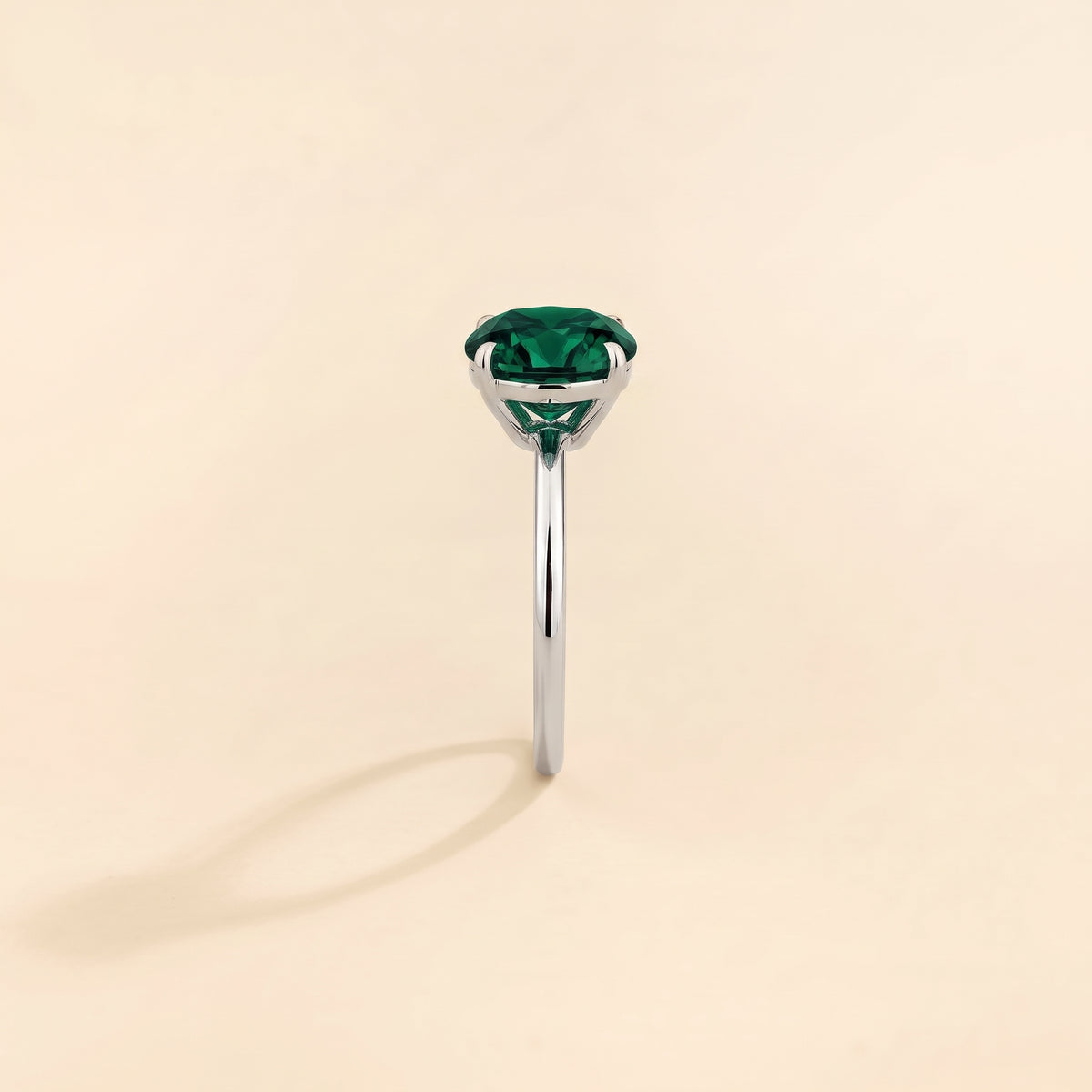Nina Round Shape Emerald Cathedral Solitaire Ring in White Gold, side edge view