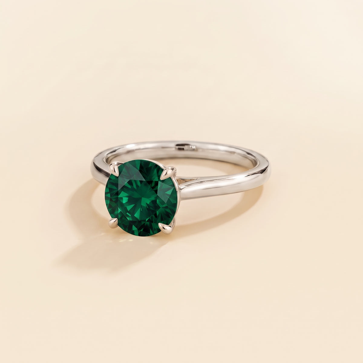Nina Round Shape Emerald Cathedral Solitaire Ring in White Gold, three-quarter view
