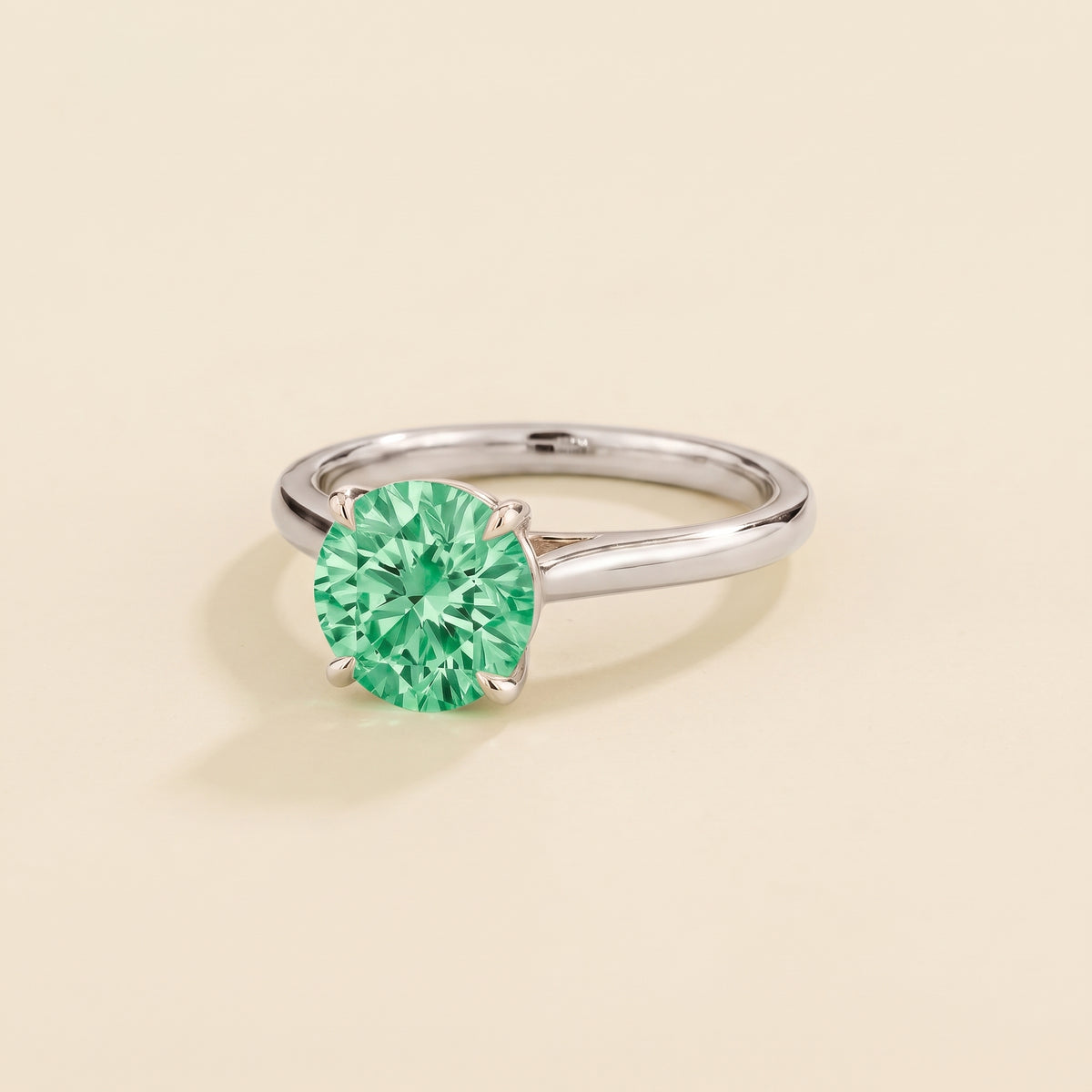 Nina Round Shape Green Sapphire Cathedral Solitaire Ring in White Gold, three-quarter view