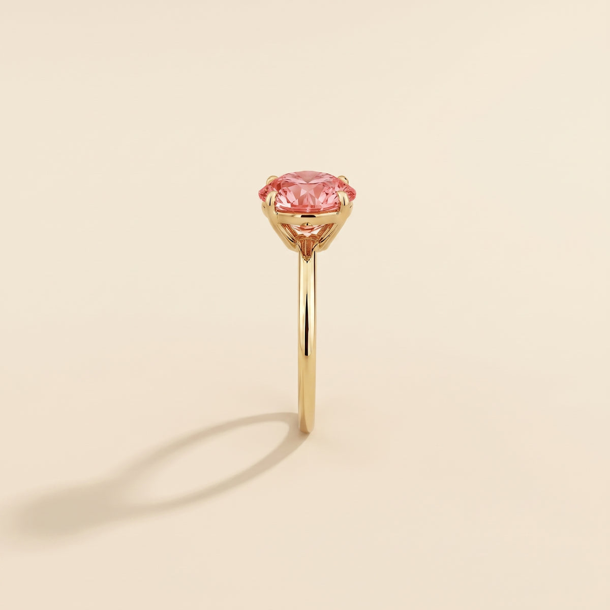 Nina Round Shape Padparadscha Sapphire Cathedral Solitaire Ring in Gold, side edge view