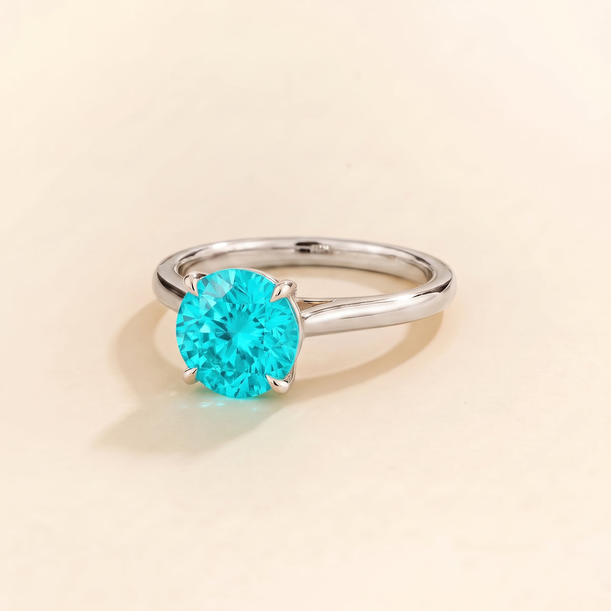 Nina Round Shape Paraiba Sapphire Cathedral Solitaire Ring in White Gold, three-quarter view