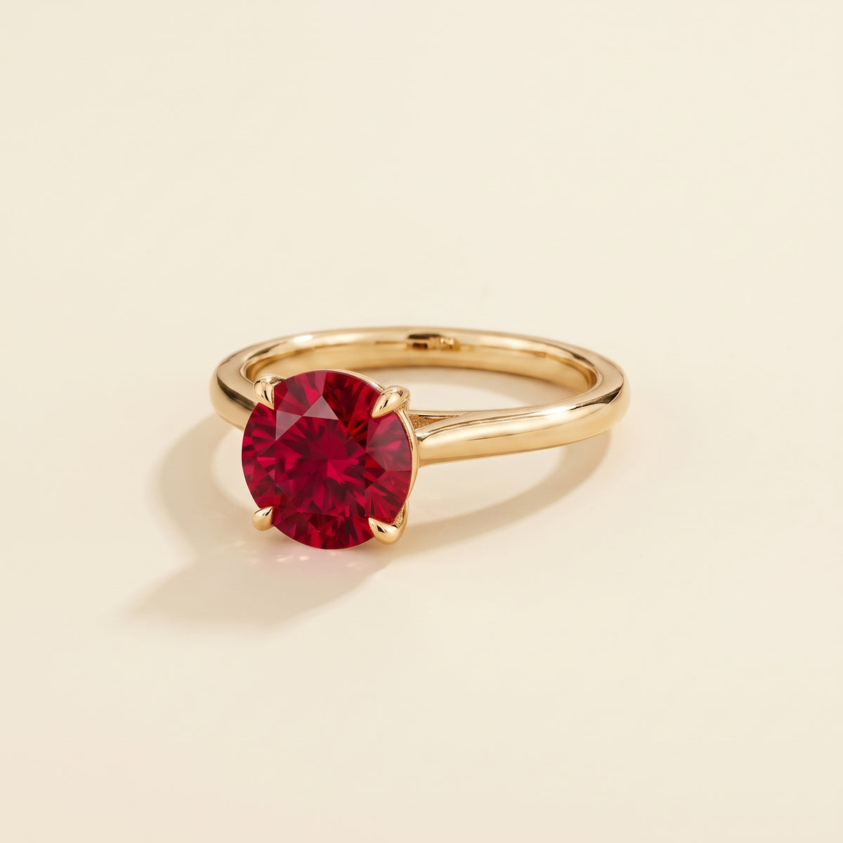 Nina Round Shape Ruby Cathedral Solitaire Ring in Gold, three-quarter view
