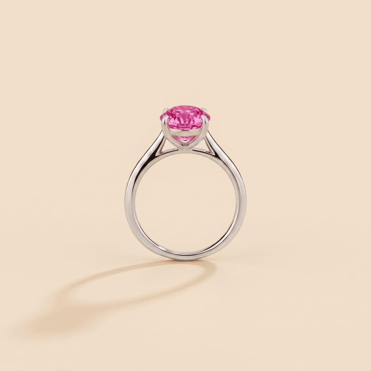 Nina Round Shape Vivid Pink Sapphire Cathedral Solitaire Ring in White Gold, side profile view