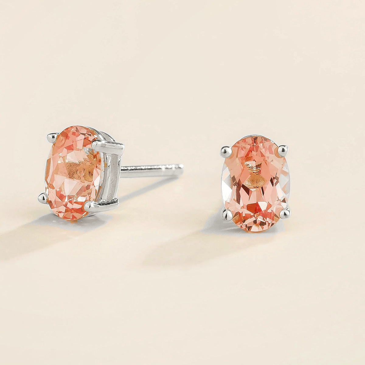 Ovo Padparadscha Sapphire Oval Stud Earrings in White Gold – angle view