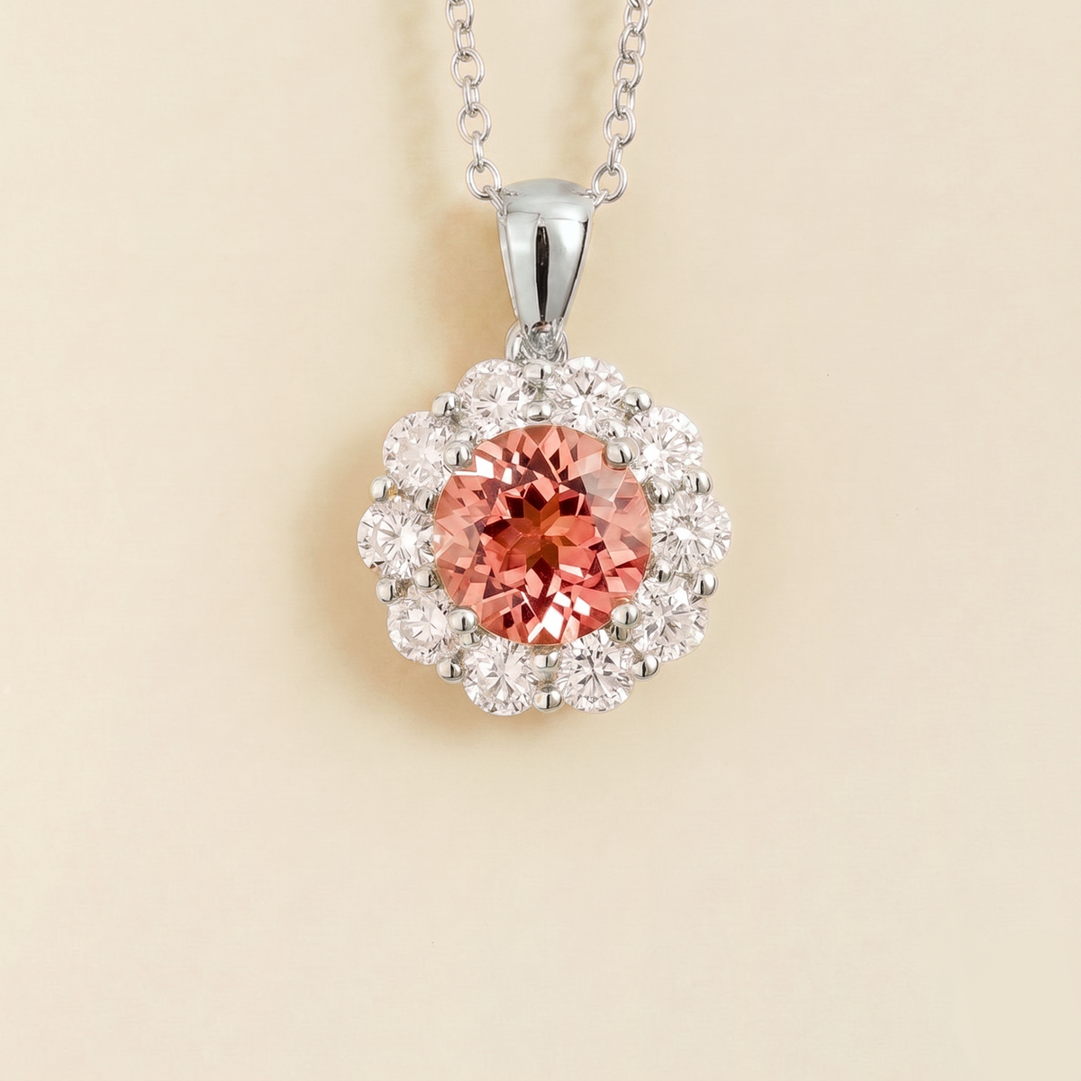 Floret round lab-grown padparadscha sapphire and diamond halo pendant necklace in white gold – front | Juvetti London