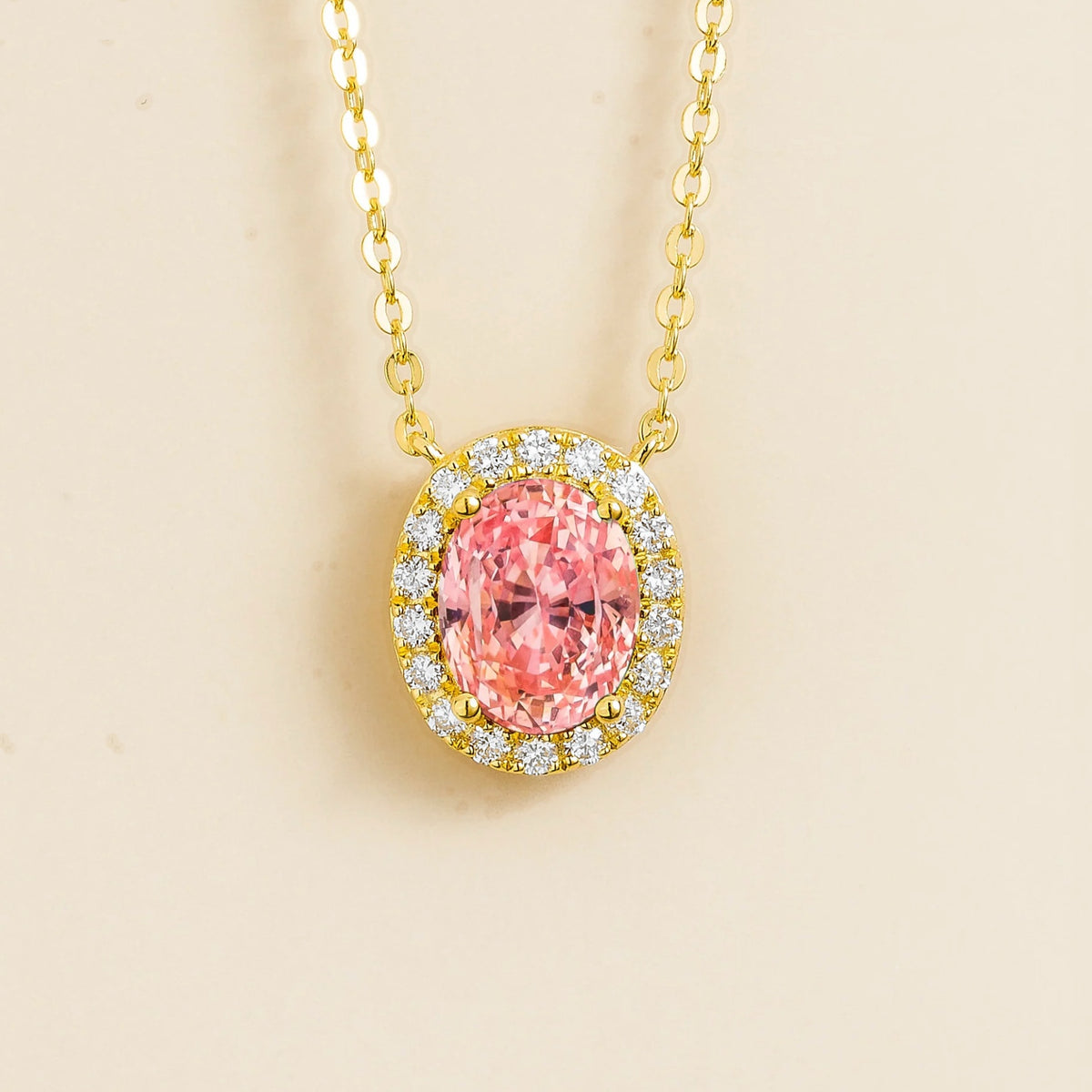 Lab-grown padparadscha sapphire and diamond oval halo necklace in gold – front view | Mina by Juvetti