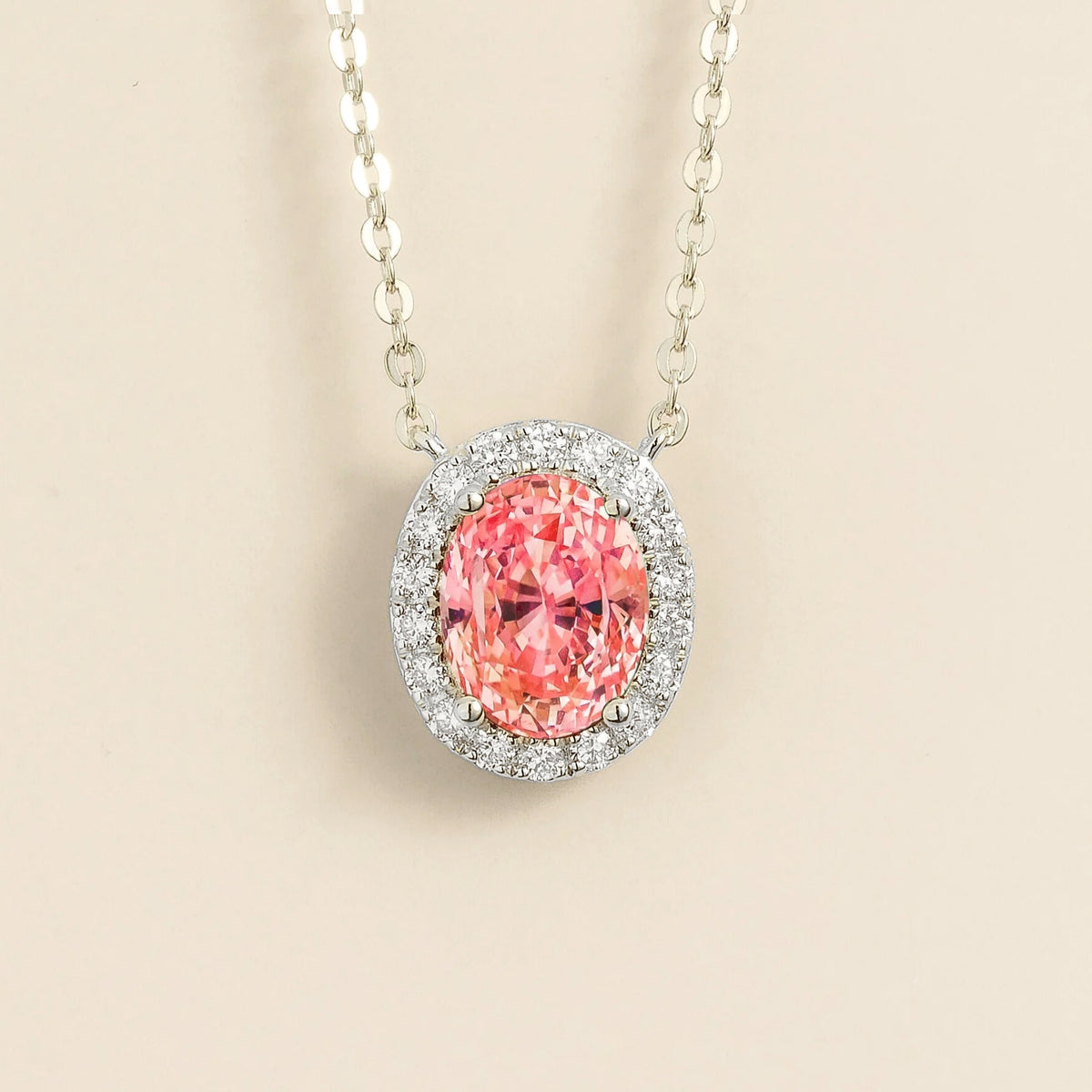 Lab-grown padparadscha sapphire and diamond oval halo necklace in white gold – front view | Mina by Juvetti