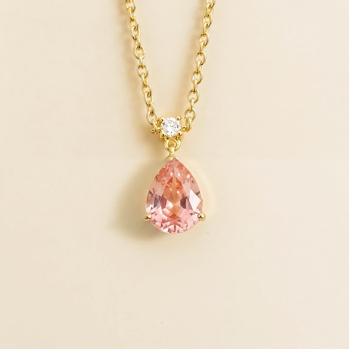 Lab-grown padparadscha sapphire and diamond pear drop pendant necklace in gold, medium – front view | Pisa by Juvetti