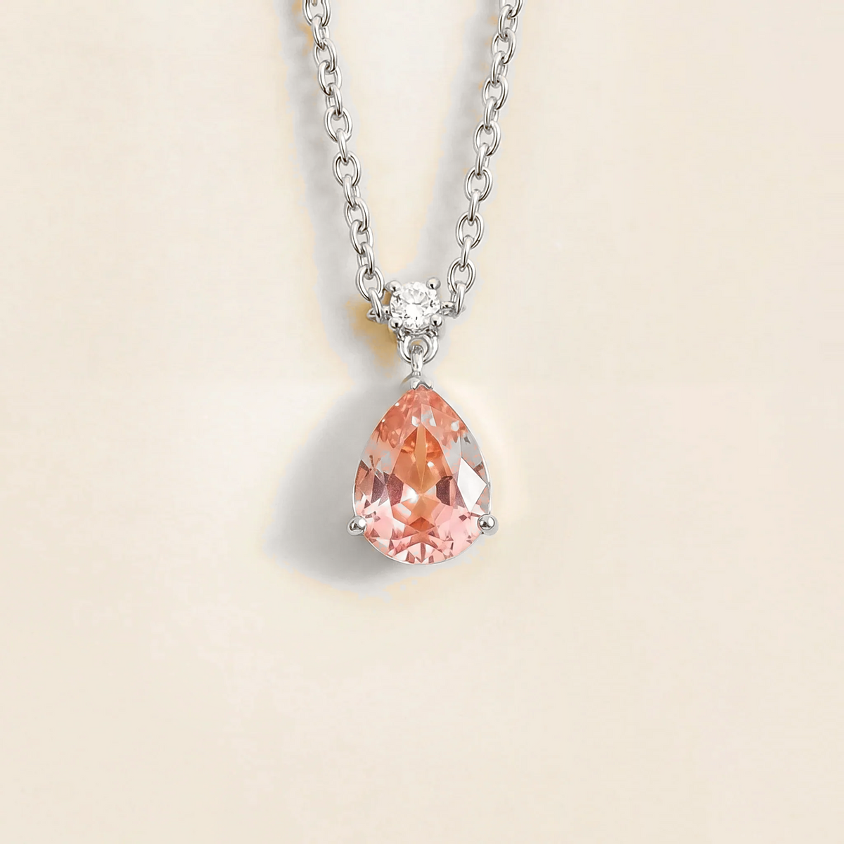 Lab-grown padparadscha sapphire and diamond pear drop pendant necklace in white gold, medium – front view | Pisa by Juvetti