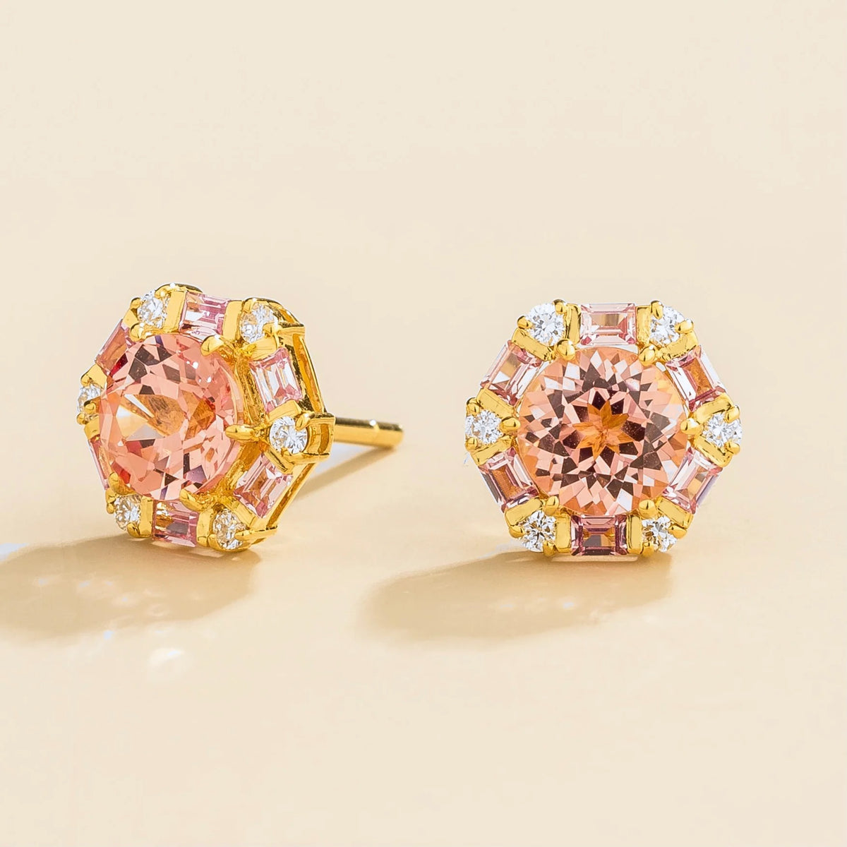 Melba Padparadscha Sapphire, Pink Sapphire & Diamond Halo Hexagon Stud Earrings in Gold – angle view