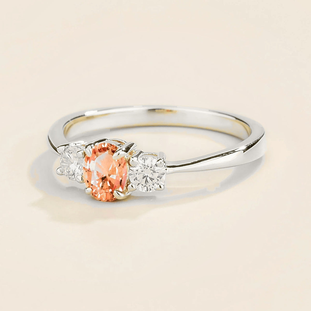 Boble Padparadscha Sapphire Oval & Diamond Three-Stone Ring in White Gold – angle view