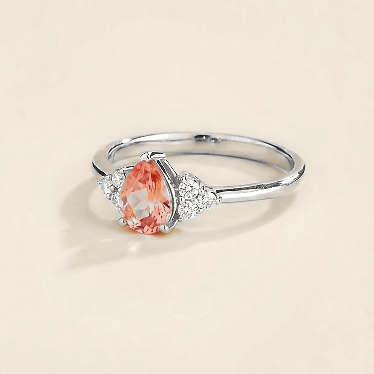 Pear-cut lab-grown padparadscha sapphire and diamond ring in white gold – side view | Pisa by Juvetti