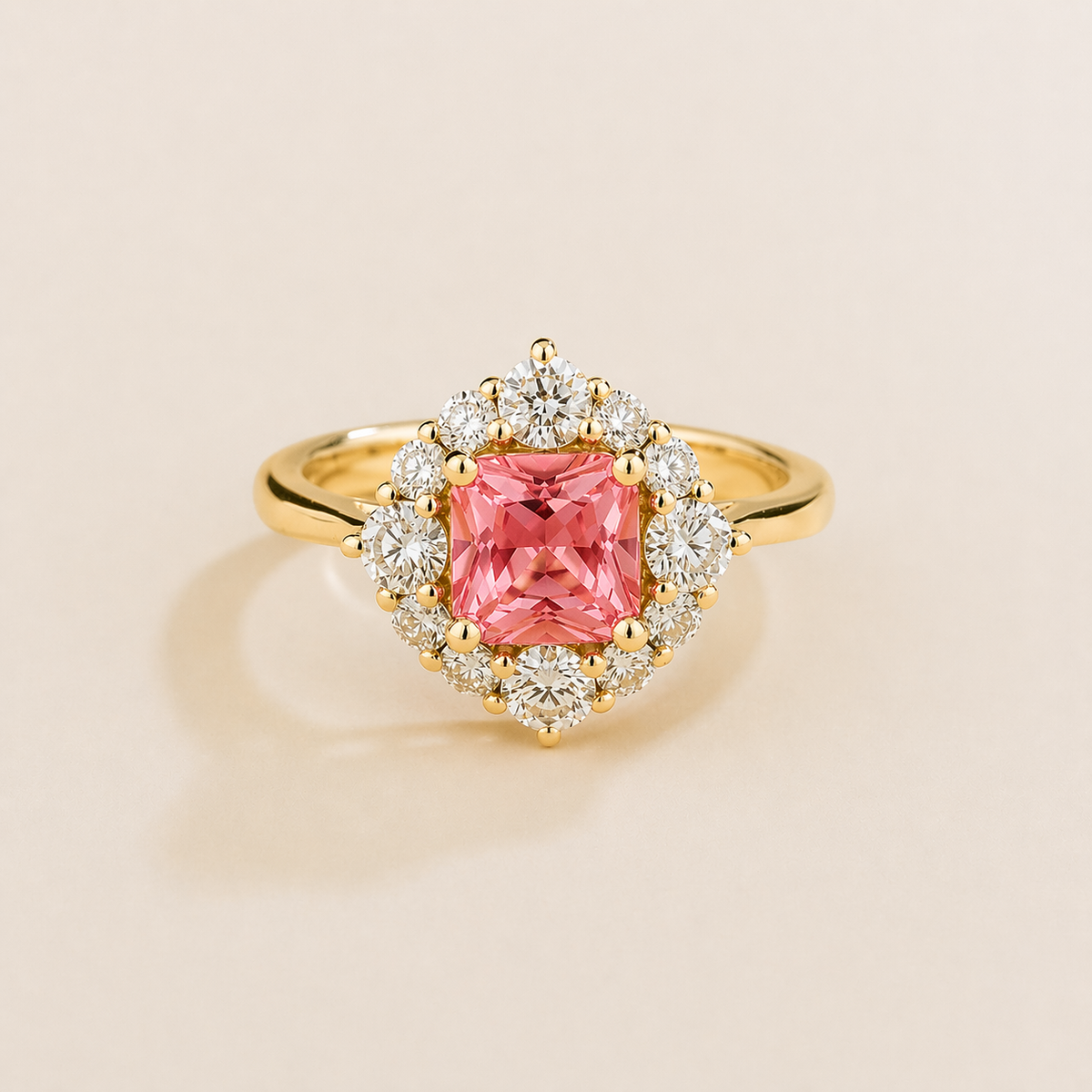 Tuli cushion-cut lab-grown Padparadscha Sapphire and diamond halo ring in gold – front view | Juvetti London