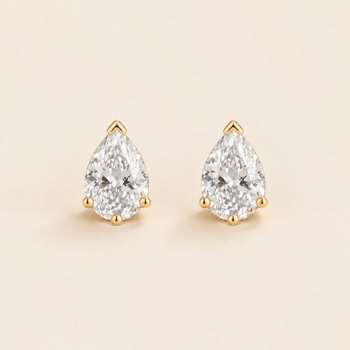 Pandal pear lab-grown diamond solitaire stud earrings in gold – front view | Juvetti