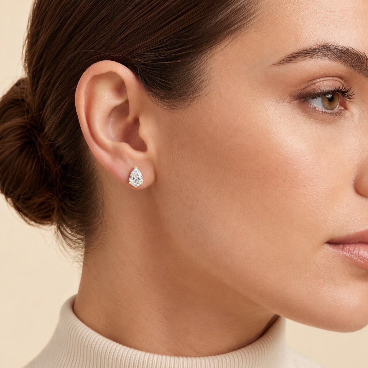 Pandal pear lab-grown diamond solitaire stud earrings in gold – on model | Juvetti