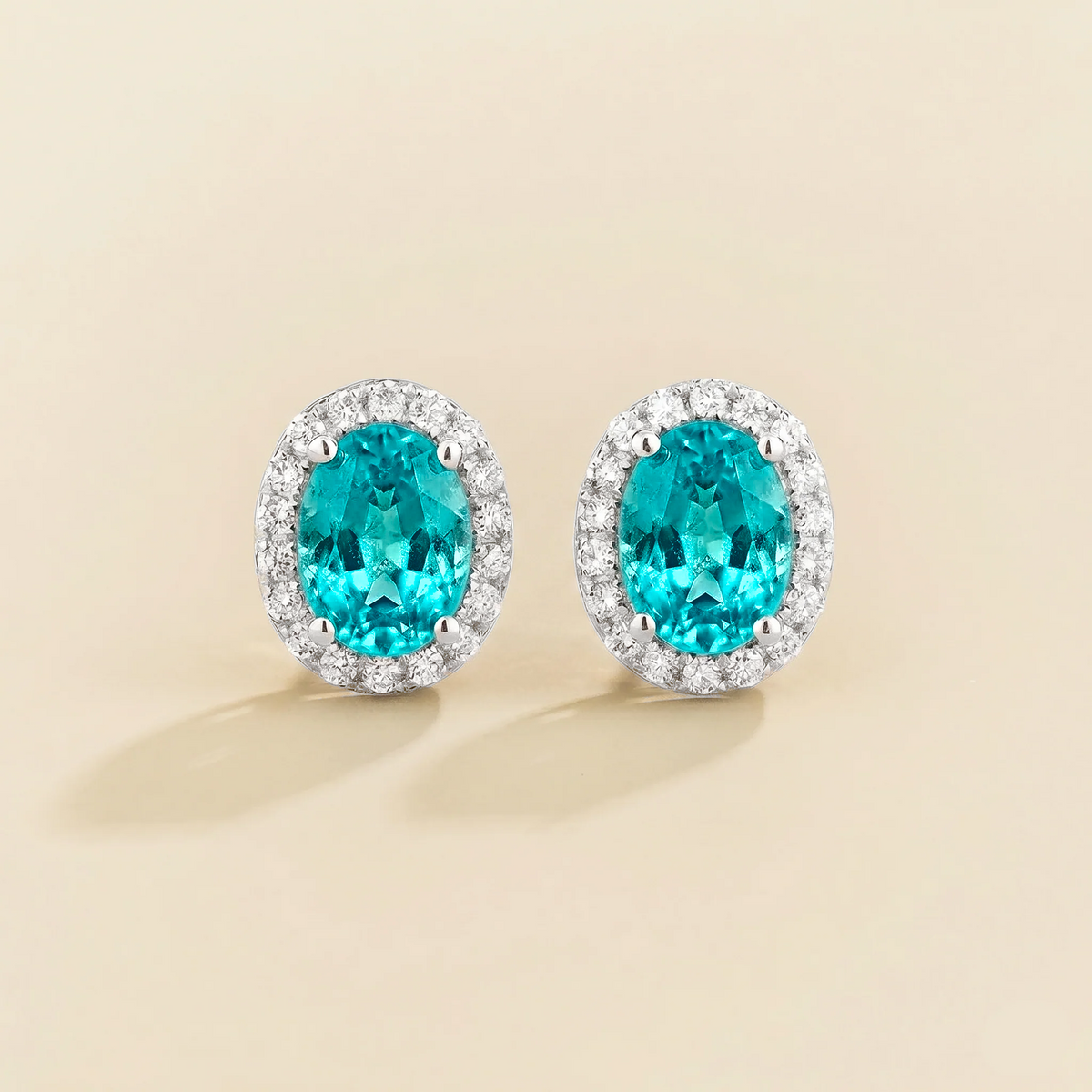 Lab-grown Paraiba sapphire and diamond oval halo stud earrings in white gold – front view | Mina by Juvetti