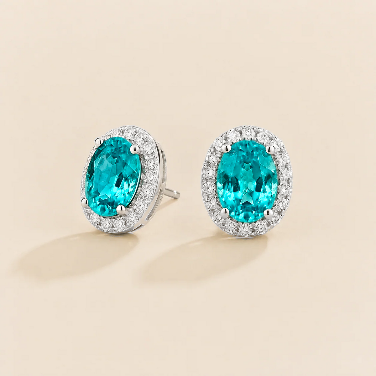 Lab-grown Paraiba sapphire and diamond oval halo stud earrings in white gold – side view | Mina by Juvetti