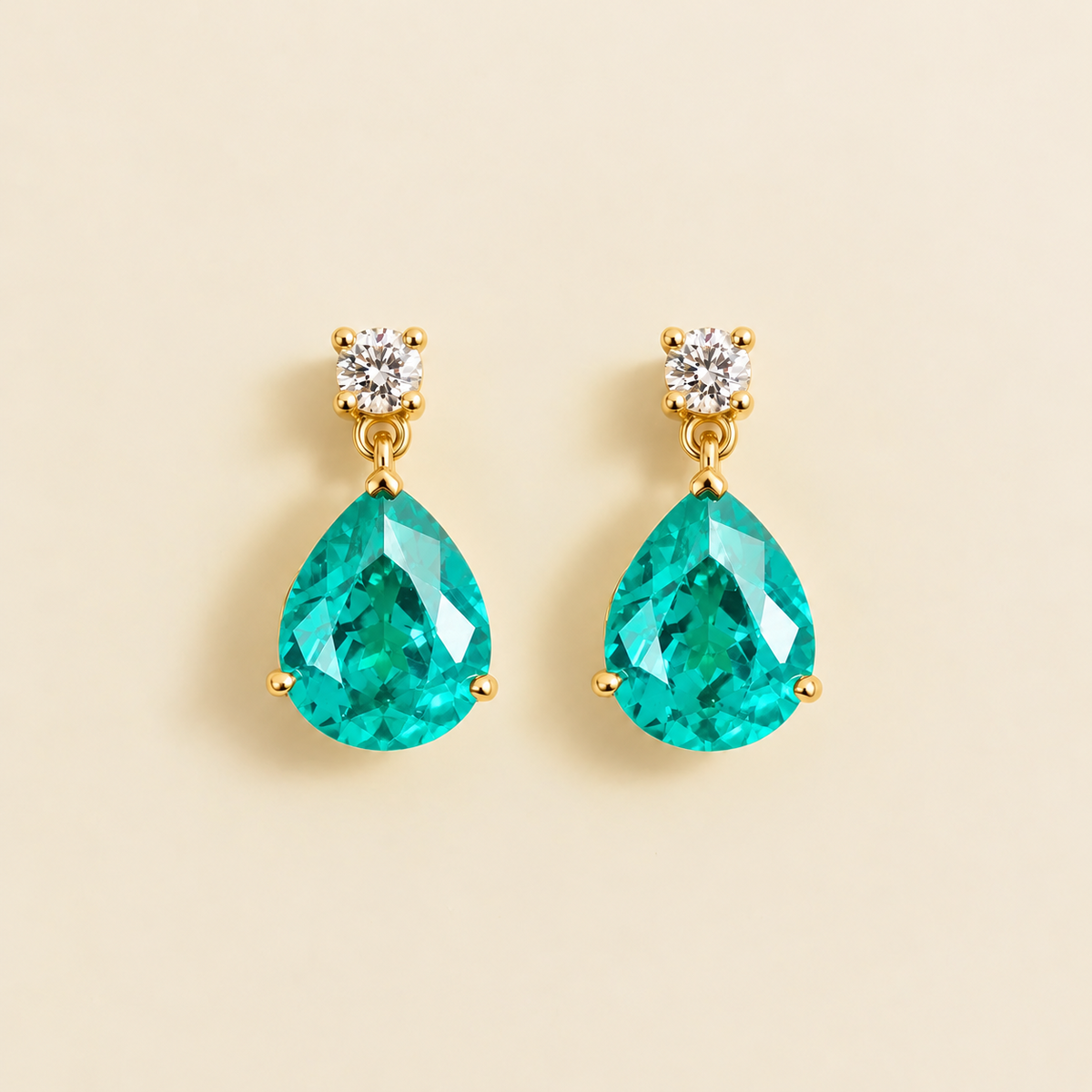Medium lab-grown Paraiba sapphire and diamond pear drop earrings in gold – front view | Pisa by Juvetti