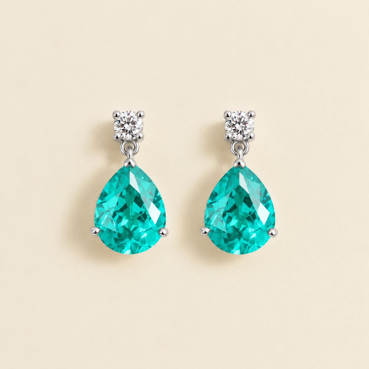Medium lab-grown Paraiba sapphire and diamond pear drop earrings in white gold – front view | Pisa by Juvetti