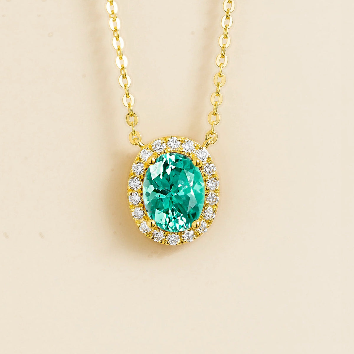 Lab-grown Paraiba sapphire and diamond oval halo necklace in gold – front view | Mina by Juvetti
