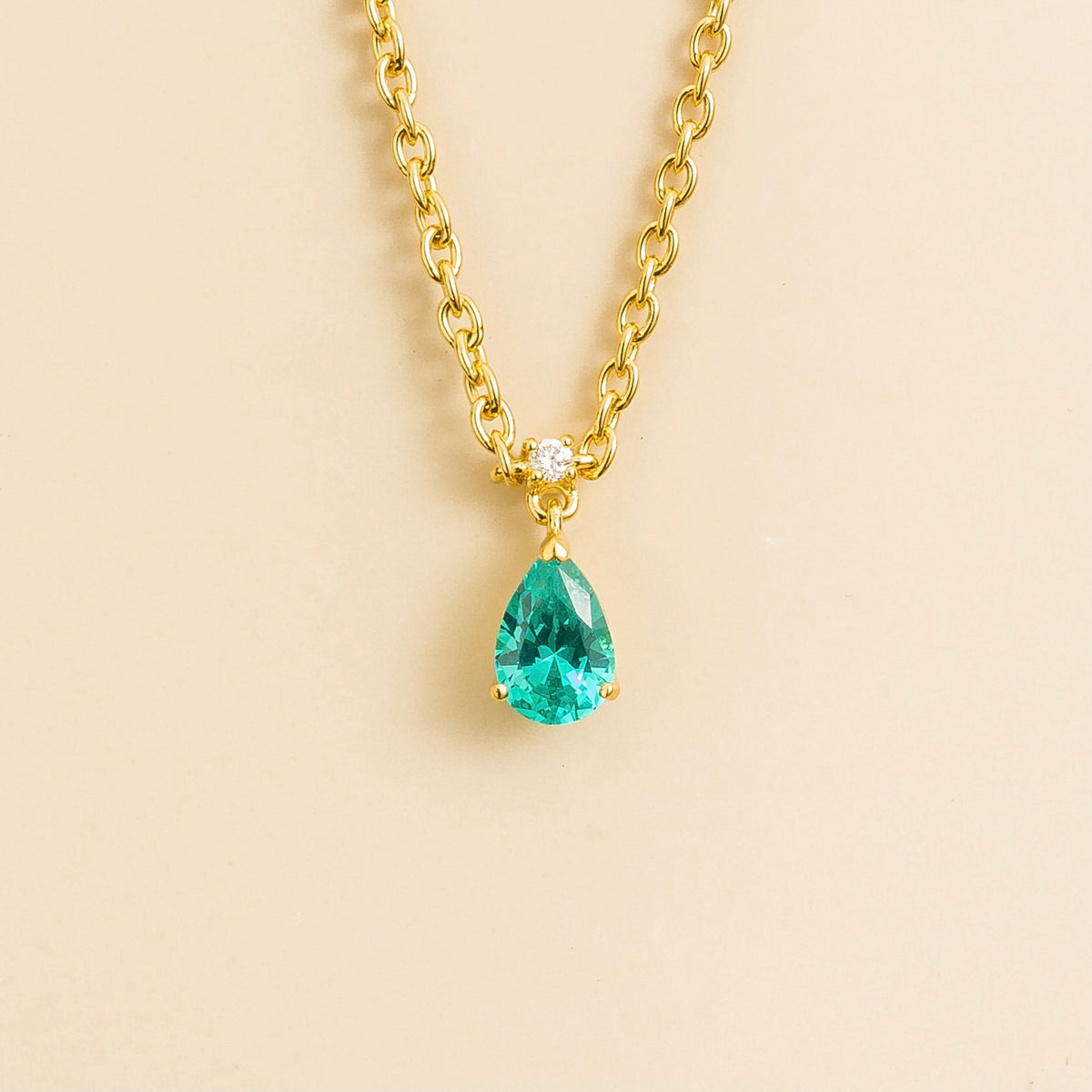 Lab-grown Paraiba sapphire and diamond pear drop pendant necklace in gold, small – front view | Pisa by Juvetti