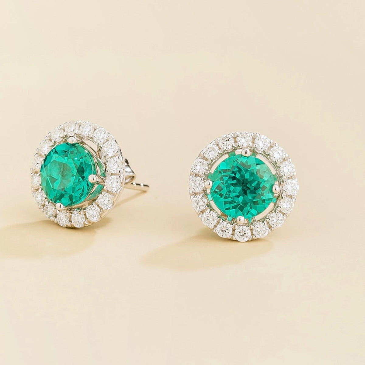 Floret round lab-grown paraiba sapphire and diamond halo stud earrings in white gold – side | Juvetti London
