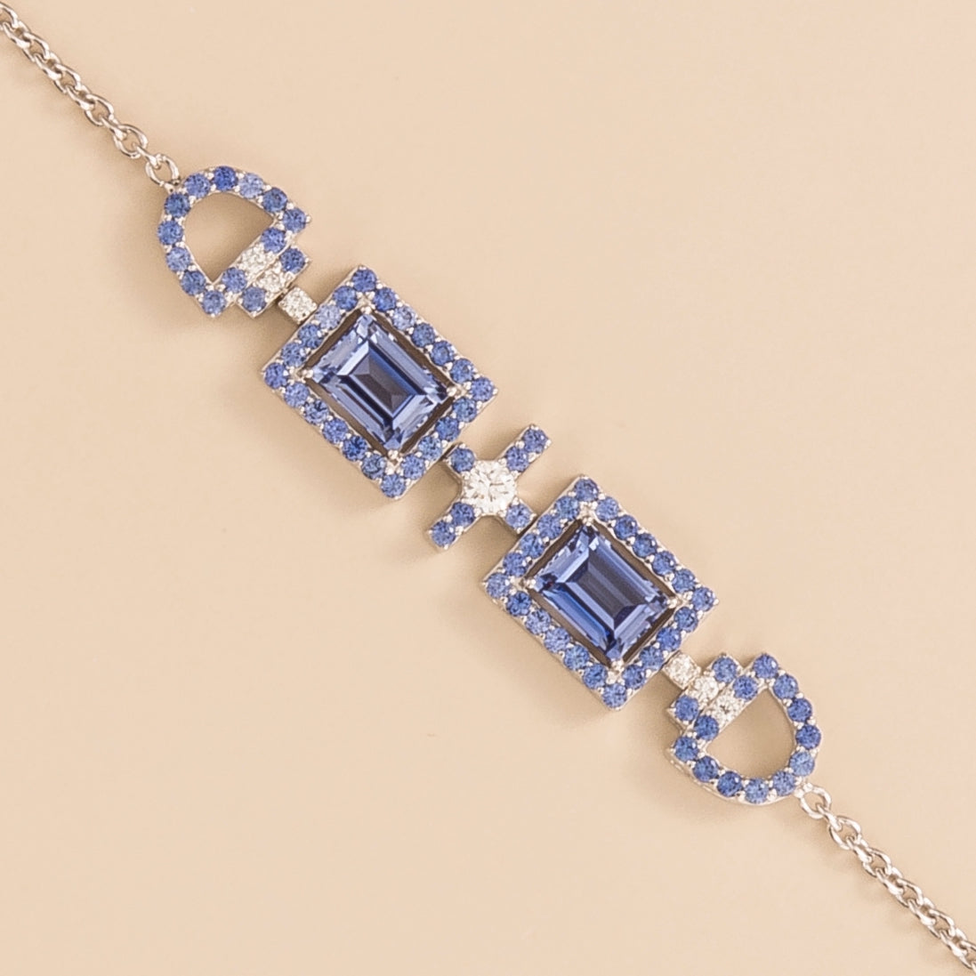 Ciceris pastel blue sapphire Art Deco halo bracelet in white gold, two emerald-cut lab-grown sapphires with diamonds, close-up | Juvetti London