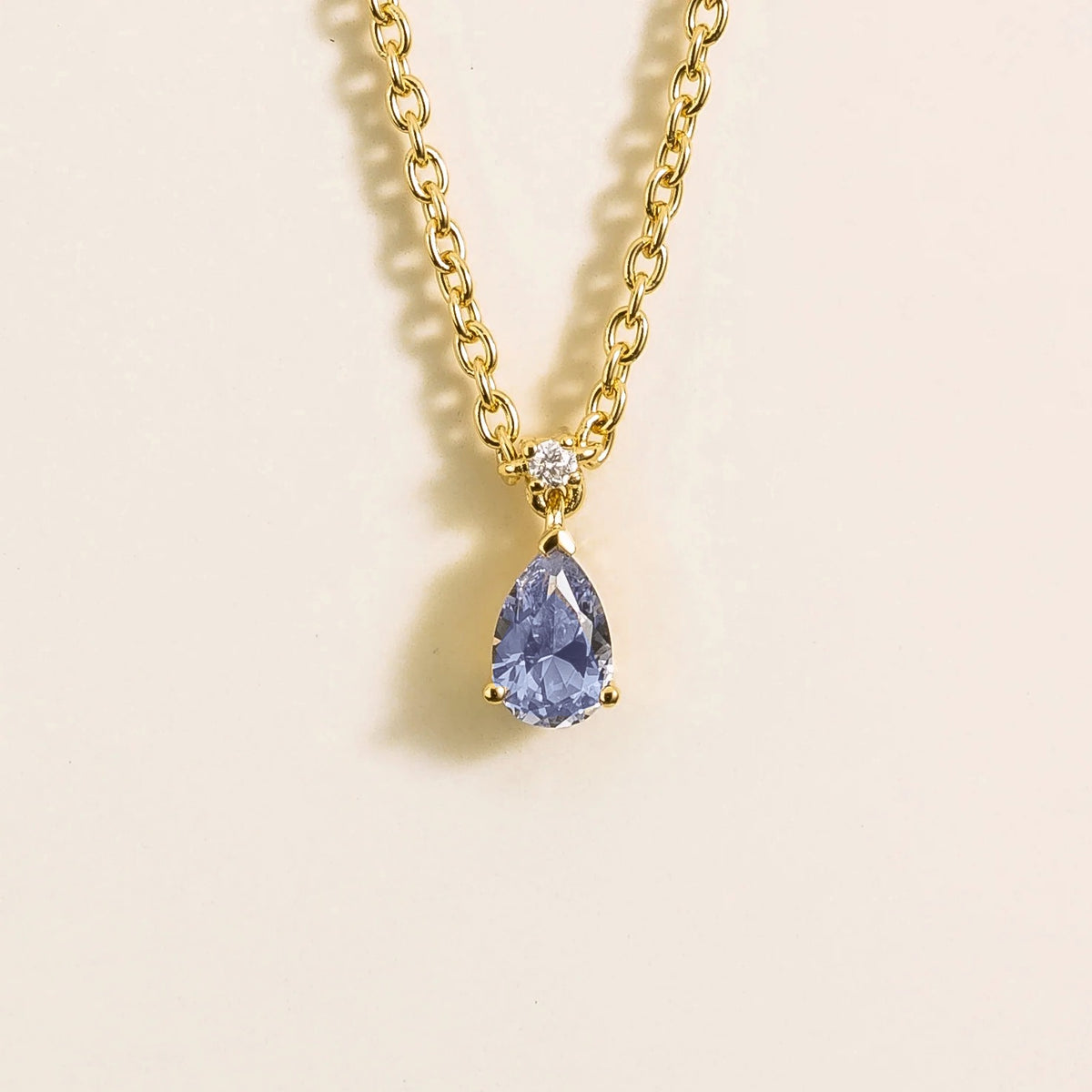 Lab-grown pastel blue sapphire and diamond pear drop pendant necklace in gold, small – front view | Pisa by Juvetti