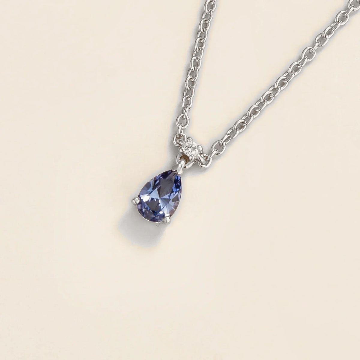 Lab-grown pastel blue sapphire and diamond pear drop pendant necklace in white gold, small – angled view | Pisa by Juvetti