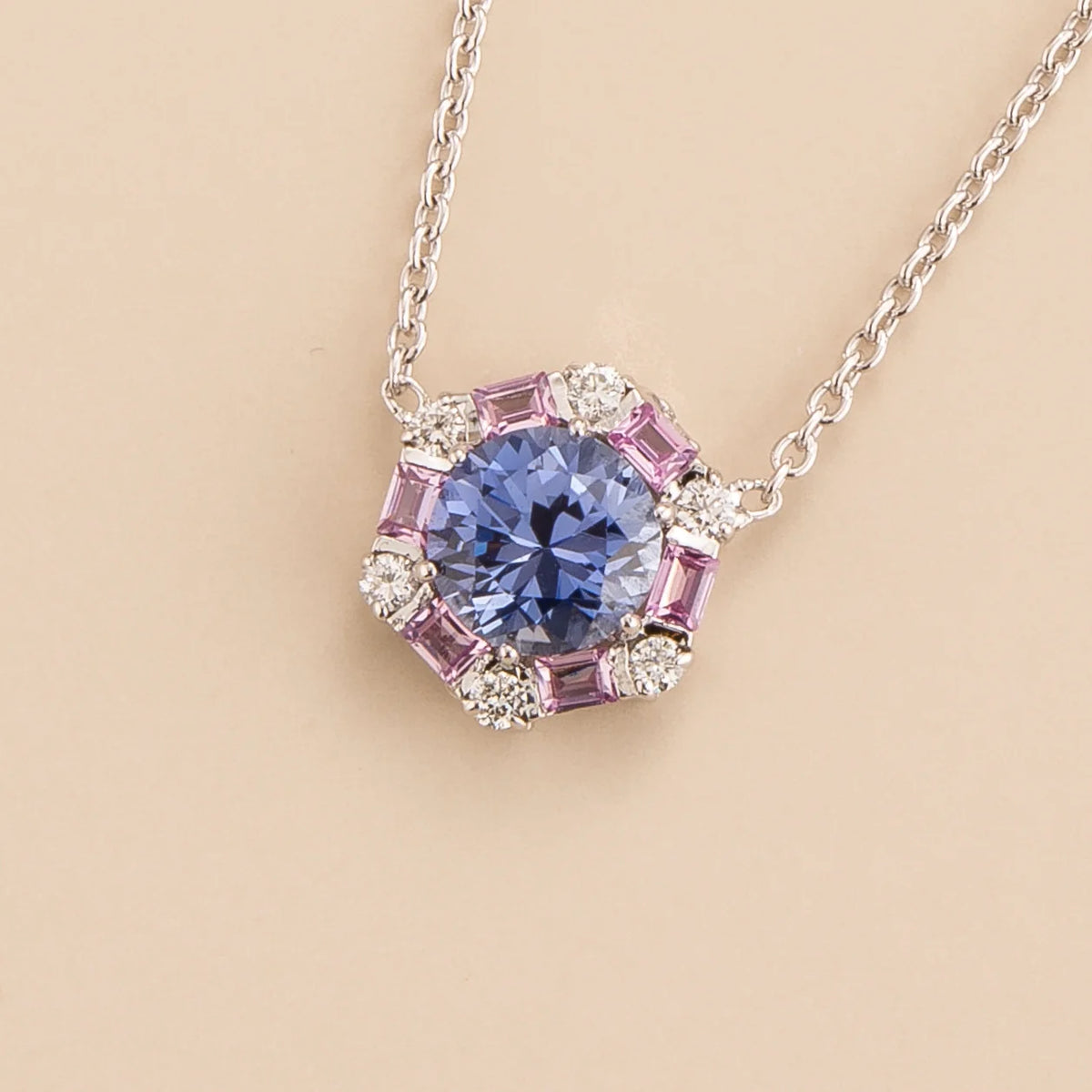 Melba hexagon necklace in 18K white gold vermeil set with lab grown pastel blue sapphire, Pink sapphire and Diamond gem stones.