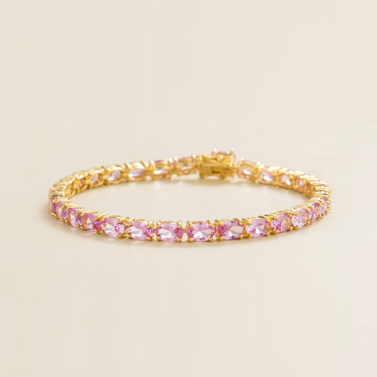 Salto pastel pink sapphire oval tennis bracelet in gold