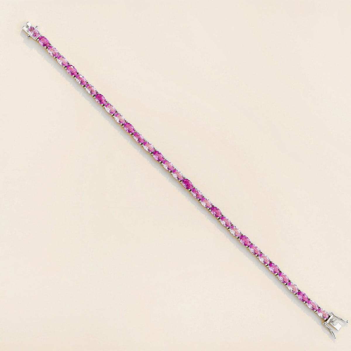 Salto Pastel Pink Sapphire Oval Tennis Bracelet in White Gold