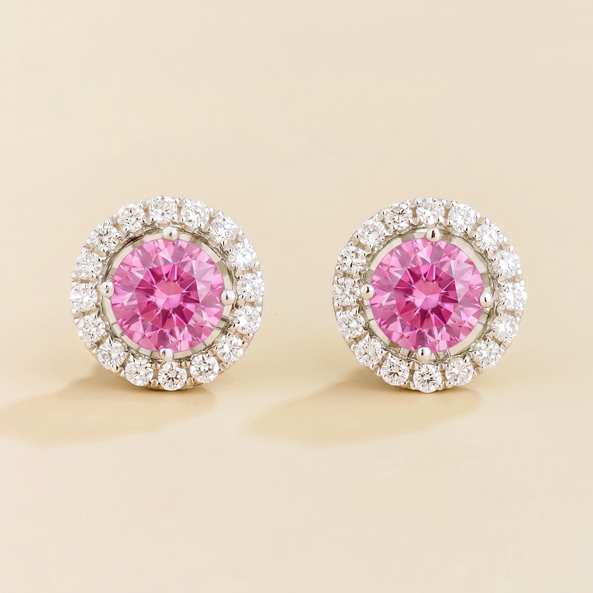 Floret round lab-grown pastel pink sapphire and diamond halo stud earrings in white gold – front | Juvetti London