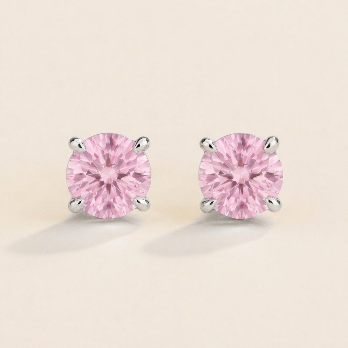 Nina round lab-grown pastel pink sapphire solitaire stud earrings in white gold – front view | Juvetti London