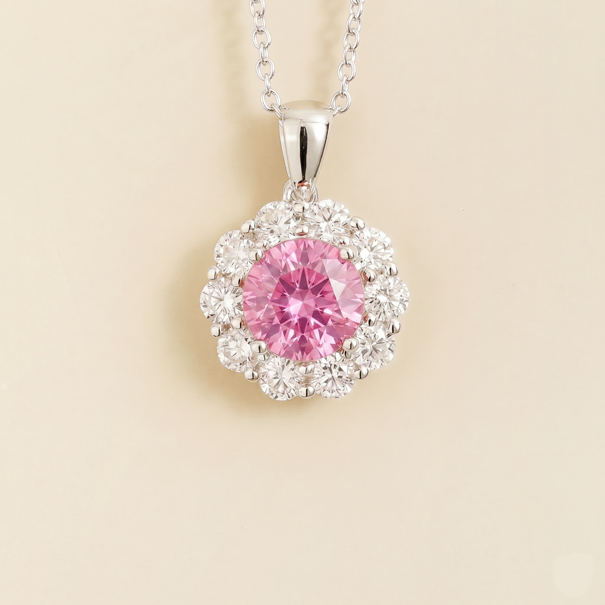 Floret round lab-grown pastel pink sapphire and diamond halo pendant necklace in white gold – front | Juvetti London