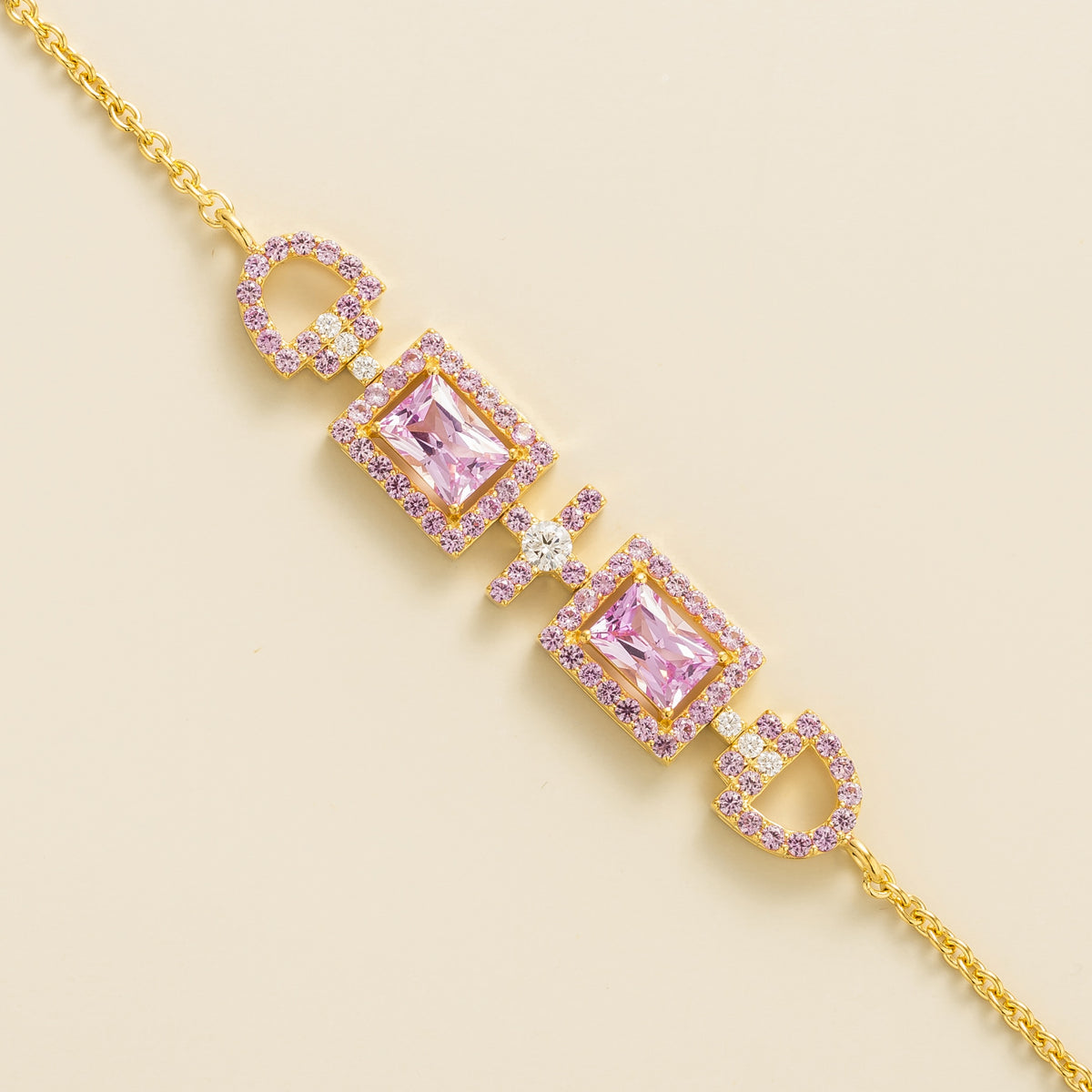 Ciceris pink sapphire Art Deco halo bracelet in gold, two emerald-cut lab-grown sapphires with diamonds, close-up | Juvetti London