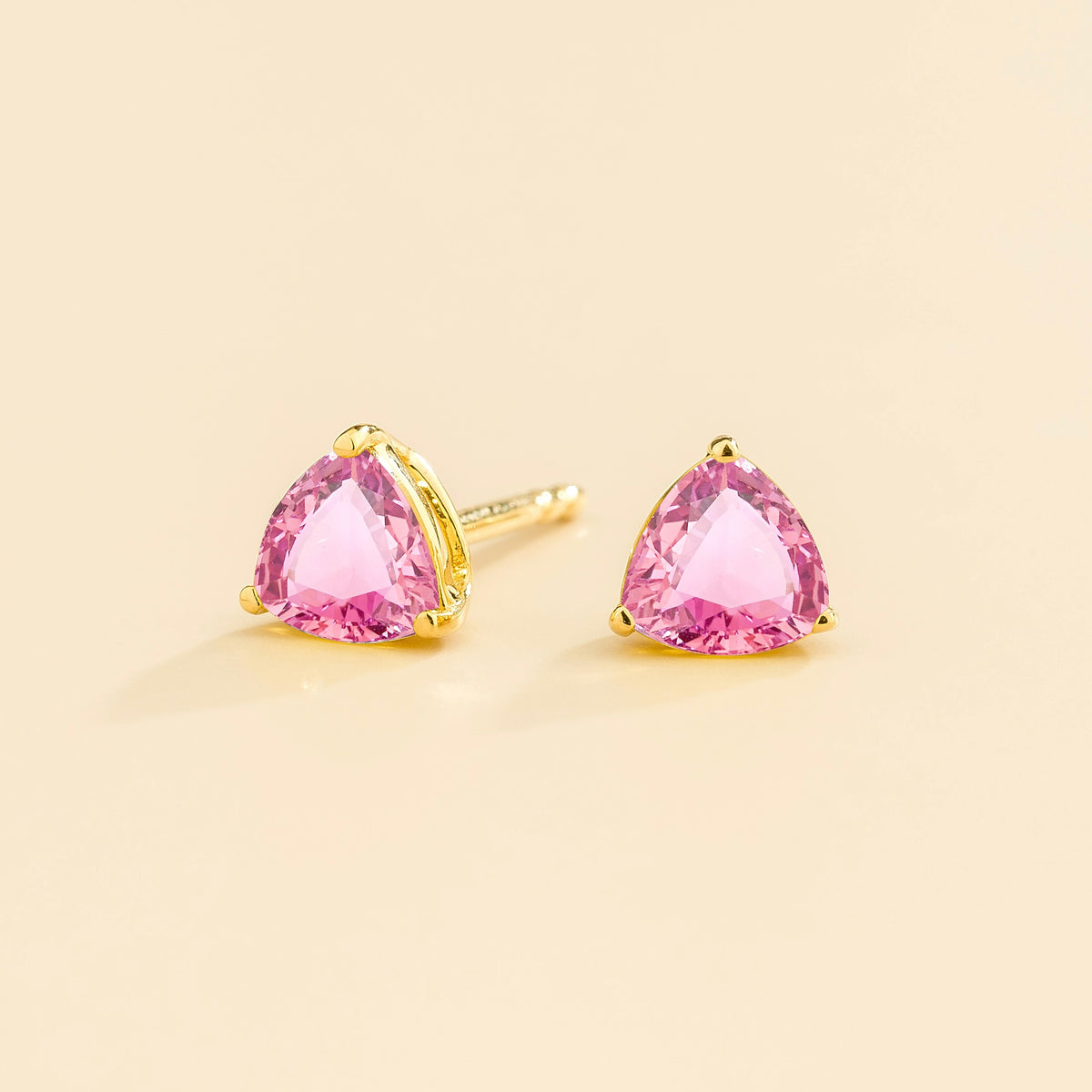 Trillion Pink Sapphire Solitaire Stud Earrings in Gold – angle view