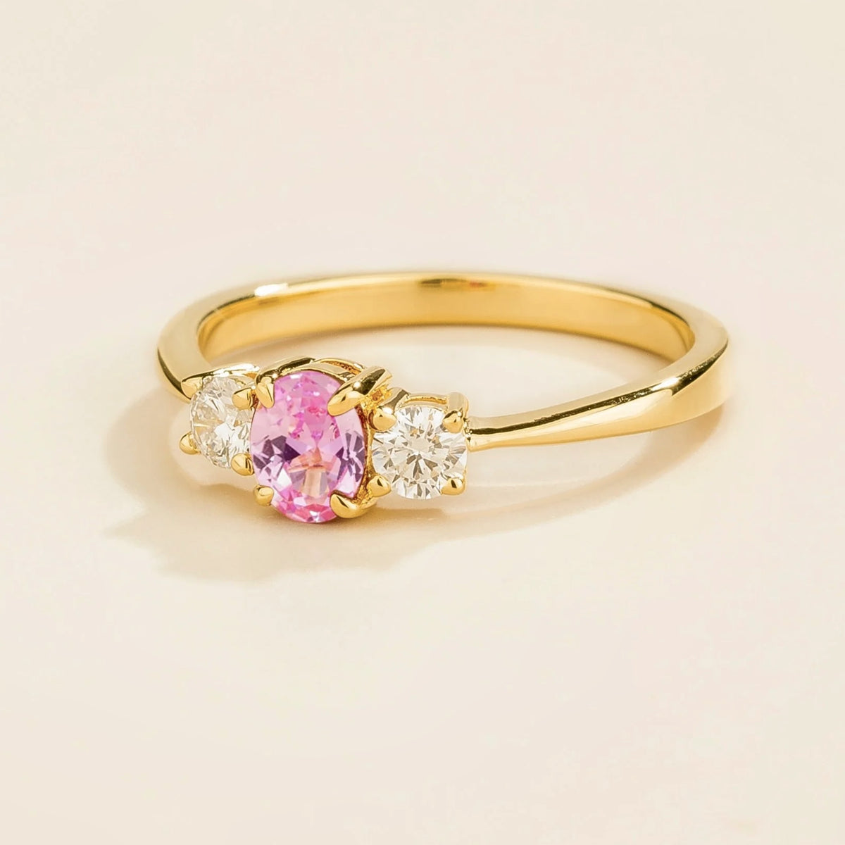 Boble Pink Sapphire Oval & Diamond Three-Stone Ring in Gold – angle view