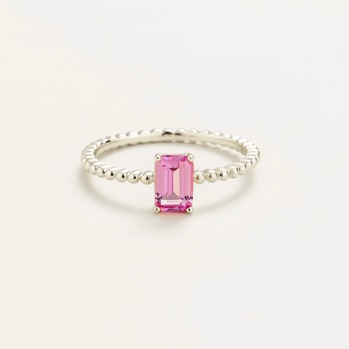 Fondi emerald-cut lab-grown pink sapphire beaded band ring in white gold – front view | Juvetti London
