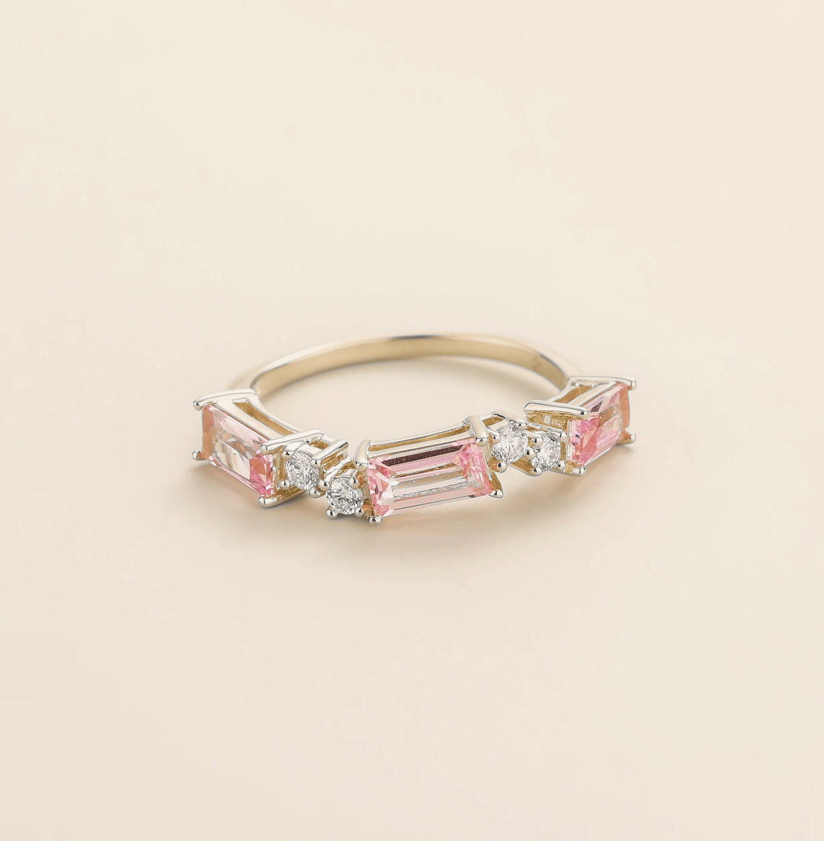 Juvetti white gold ring showcasing ethical lab-grown baguette-cut pink sapphires and round brilliant diamonds.