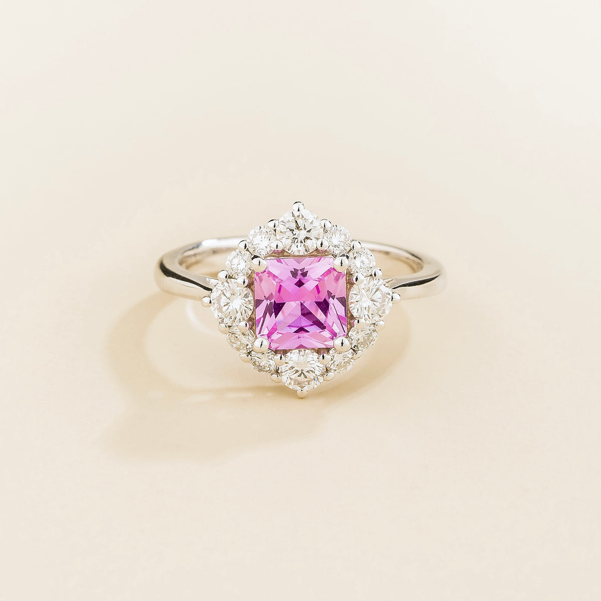 Tuli cushion-cut lab-grown pink sapphire and diamond halo ring in white gold – front view | Juvetti London