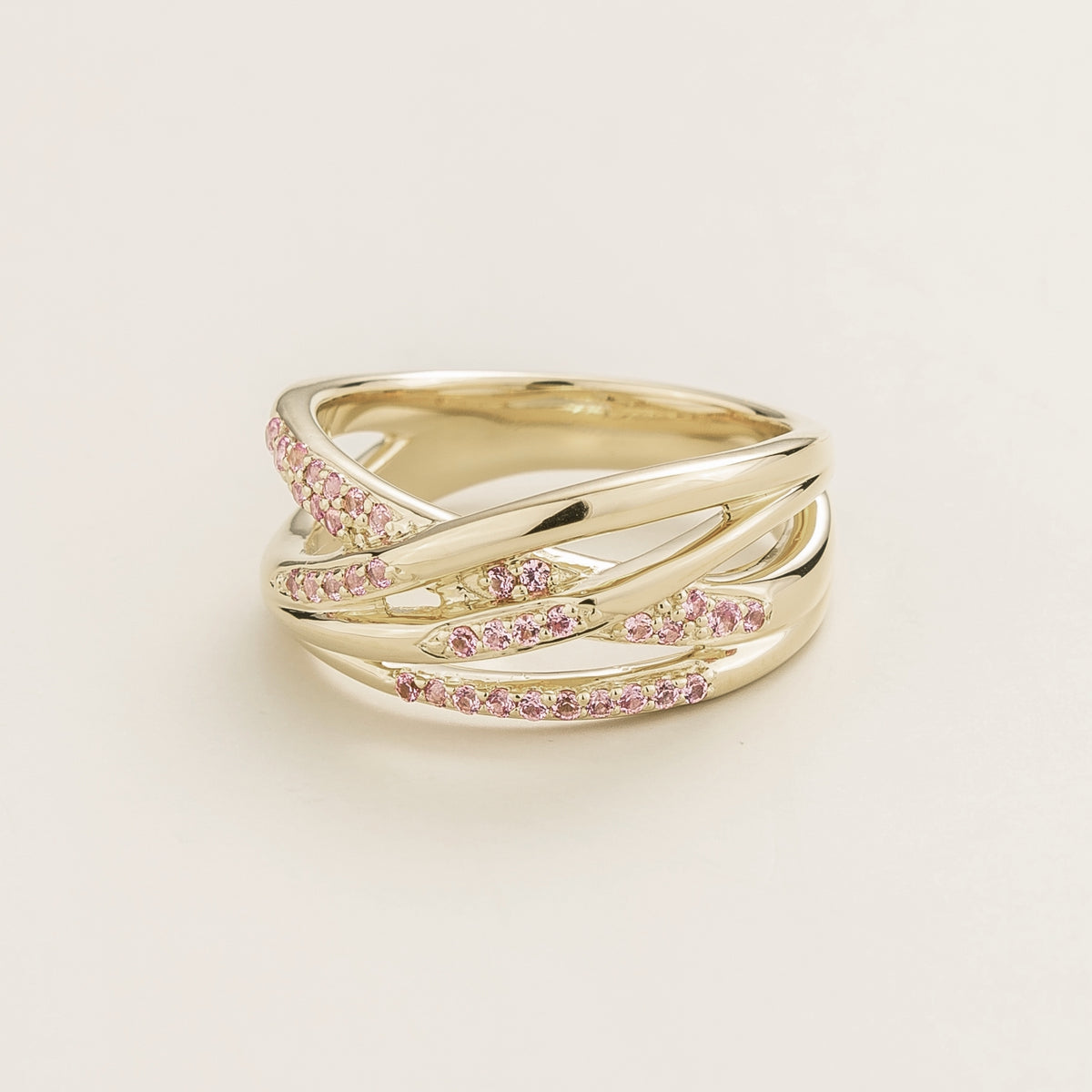 Val multi-row crossover band ring with lab-grown pink sapphires in white gold – angle view | Juvetti London