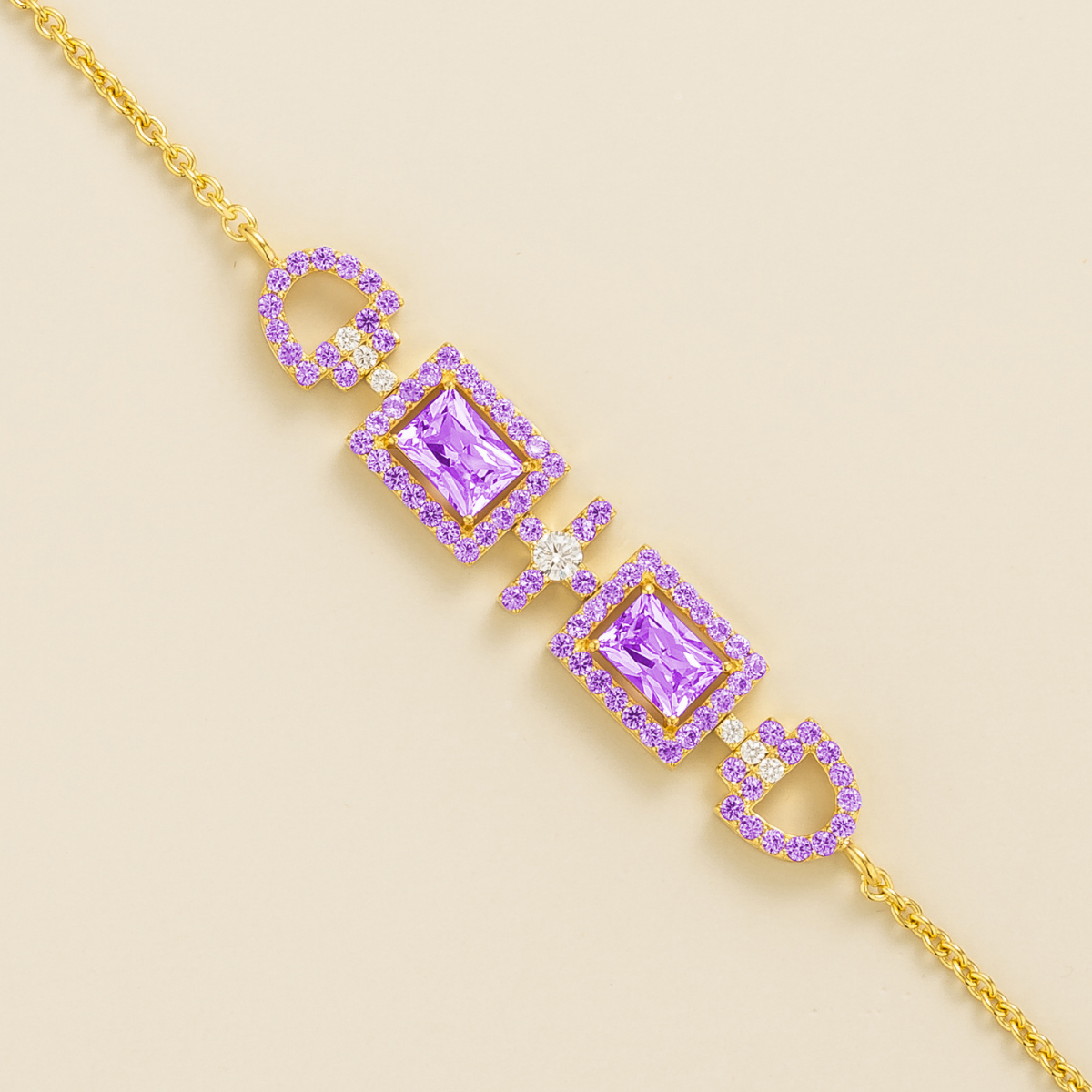 Ciceris purple sapphire Art Deco halo bracelet in gold, two emerald-cut lab-grown sapphires with diamonds, close-up | Juvetti London