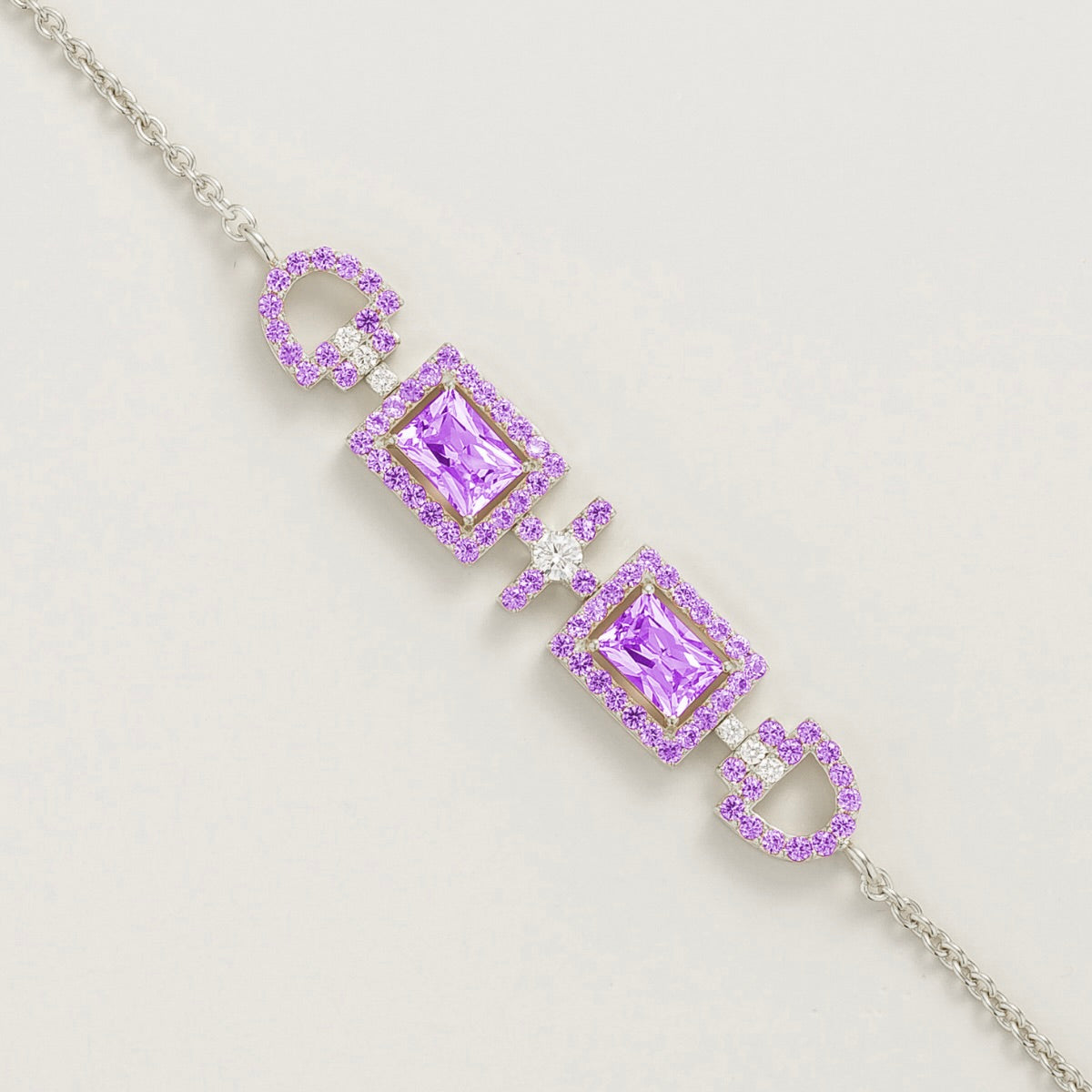 Ciceris purple sapphire Art Deco halo bracelet in white gold, two emerald-cut lab-grown sapphires with diamonds, close-up | Juvetti London